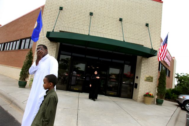 ELIZABETH FLORES¥ eflores@startribune.com
June 12, 2009 - Burnsville, MN - Amar Rashid, 14, left, and his brother Zuber Yusuf, 7, of Burnsville waited outside the new Islamic Institute of Minnesota Mosque after a prayer service.